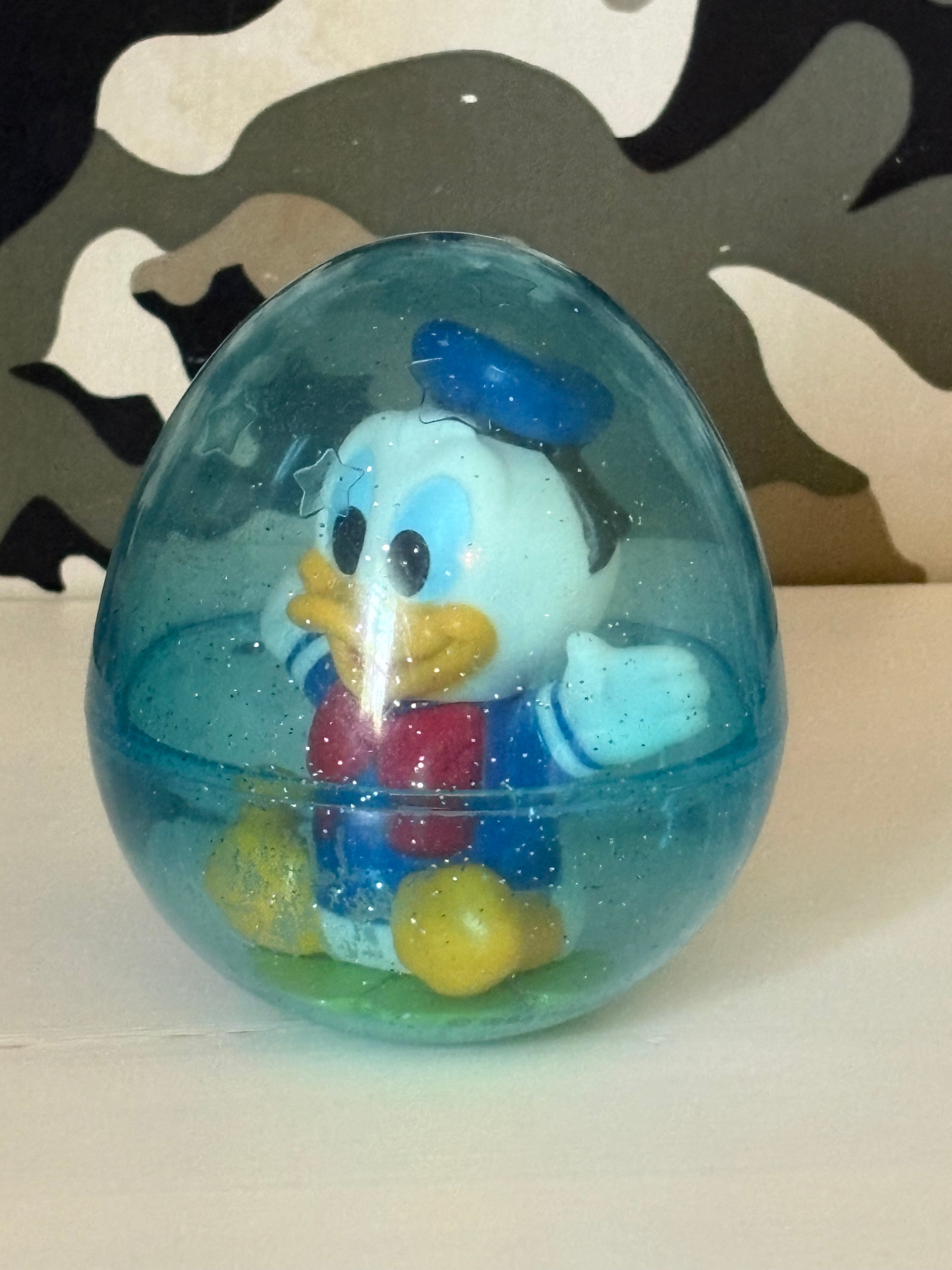Vintage Kalle Anka i plastbubbla med stansade stjärnor i plasten 1960/70 tal.