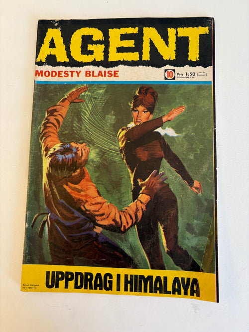 Fem st retro Agent X9 varav Agent Modesty Blaise från 1968.