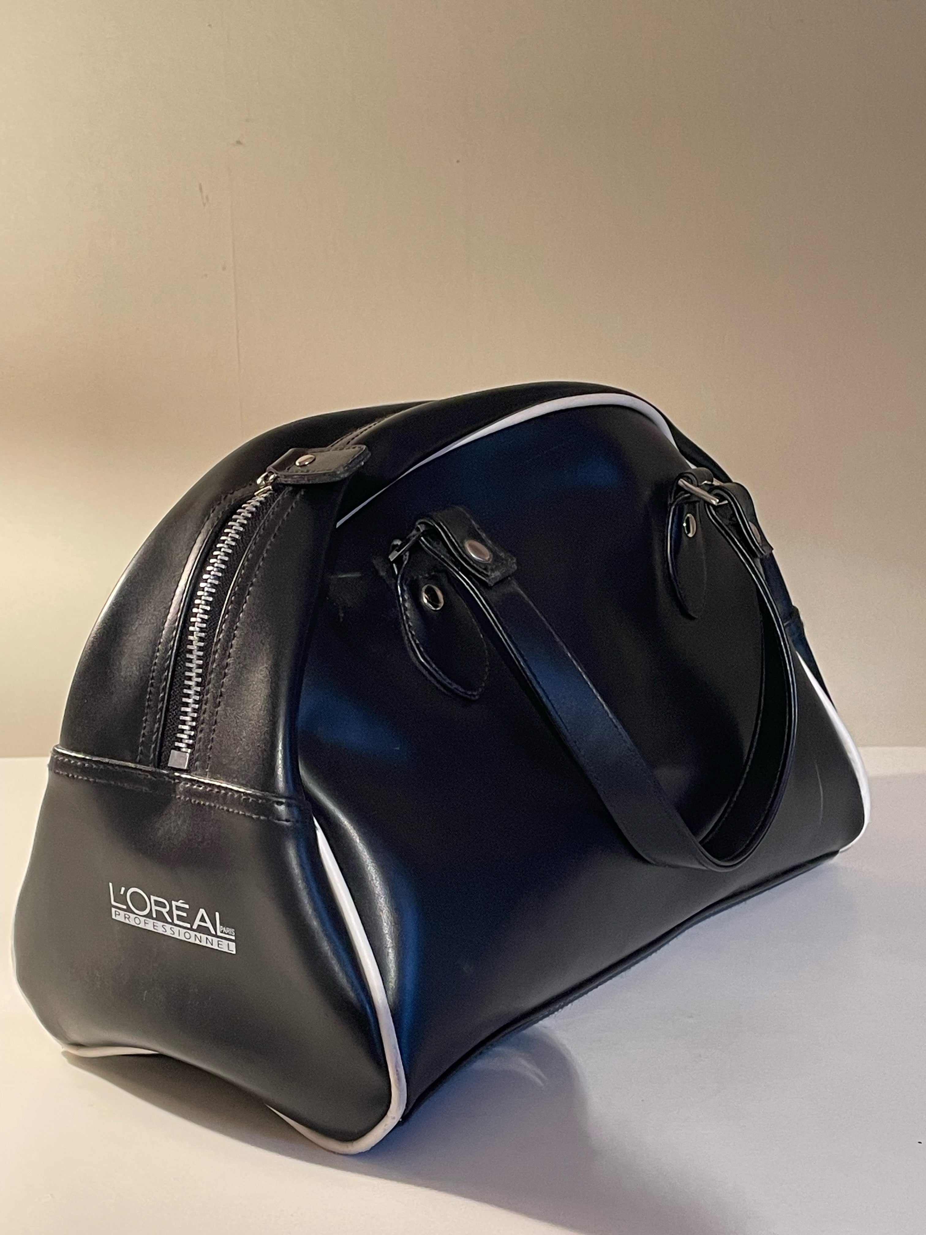 Snygg duffelbag i äkta skinn från L’OREAL i nyskick.